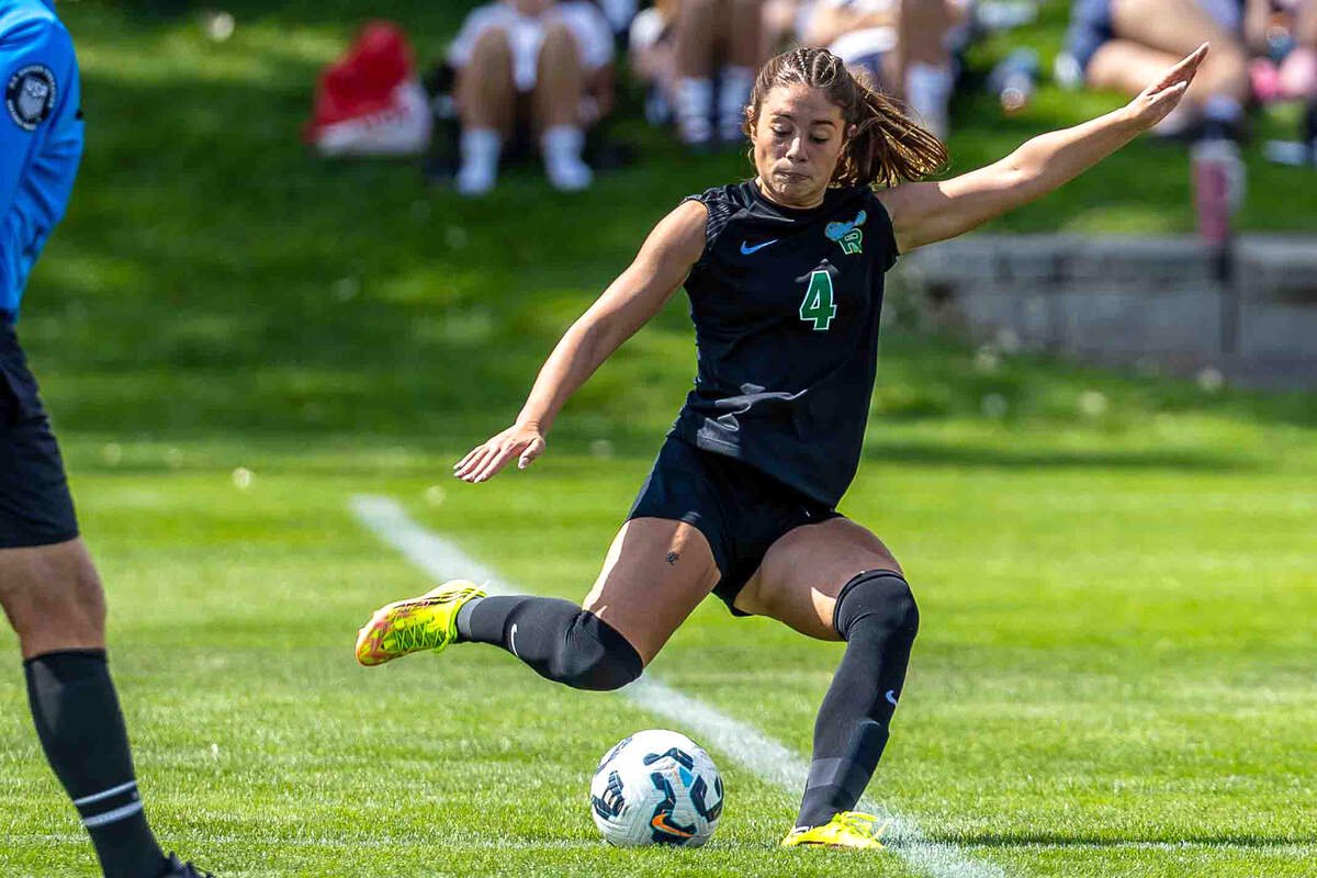 Richland junior Abby Harris (4) strikes the ball during a non-league girls soccer match against Gonzaga Prep on Saturday, Sept. 5, 2026, at Richland High School. Harris is one of four players first-year girls coach Mike Pardini identified as key to the Bombers this season, describing her as “very dangerous in the attack.”