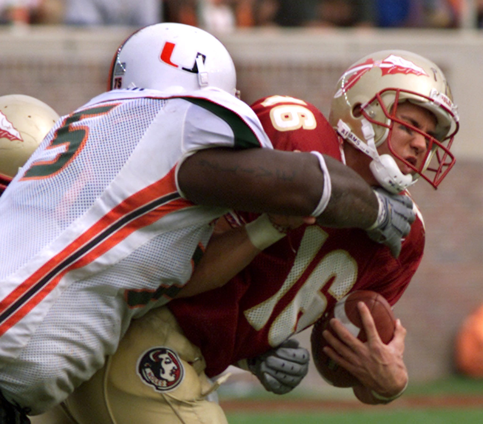 University of Miami right tackel Vince Wilford (75) sacks Florida State
Seminoles quarterback Chris Rix (16) in the third quarter at Doak
Campbell Stadium in Tallahassee, Florida on October 13, 2001. Miami
went on to defeat the Seminoles 49 to 27, ending Florida States 54 home
game winning streak. REUTERS/Charles Luzier

CWL/ME