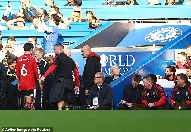 Lisandro Martinez (left) got ignored by boss Michael Carrick (right) after his sending off