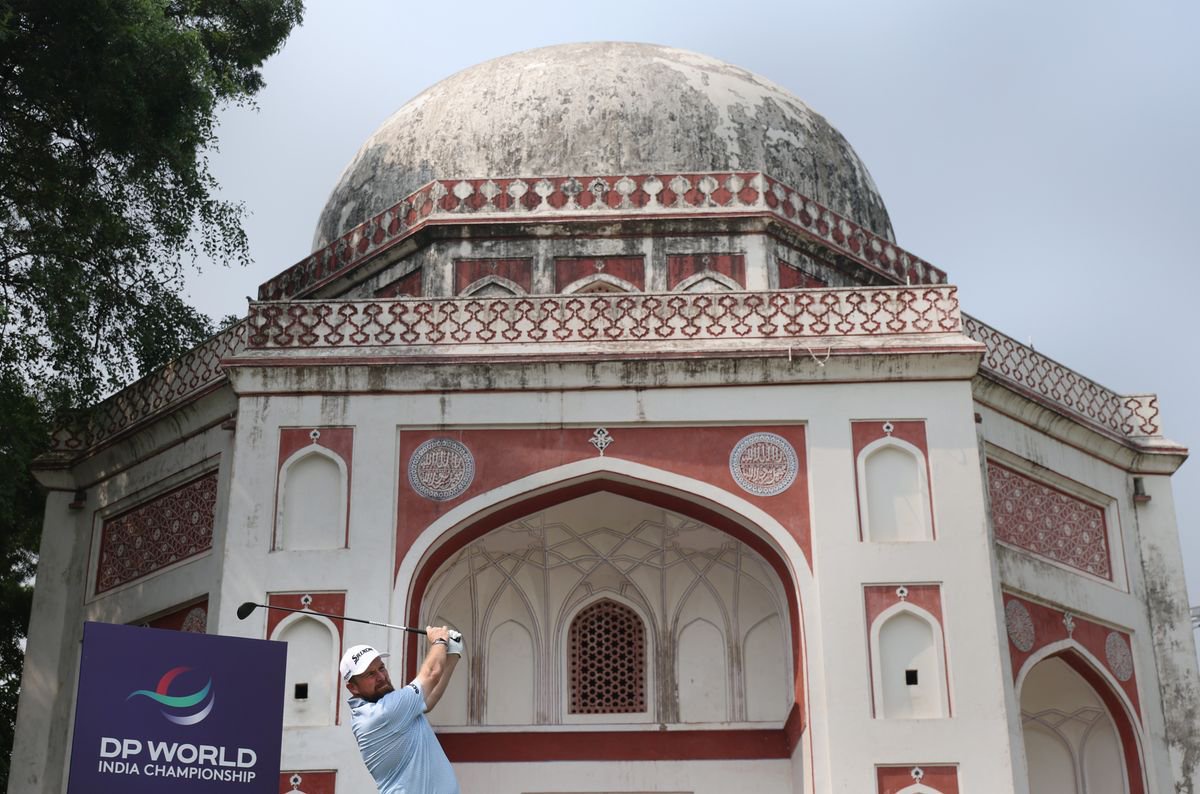 The Delhi Golf Club is one of the most picturesque courses on the DP World Tour, with historic temples surrounding it. Here, Shane Lowry tees off.