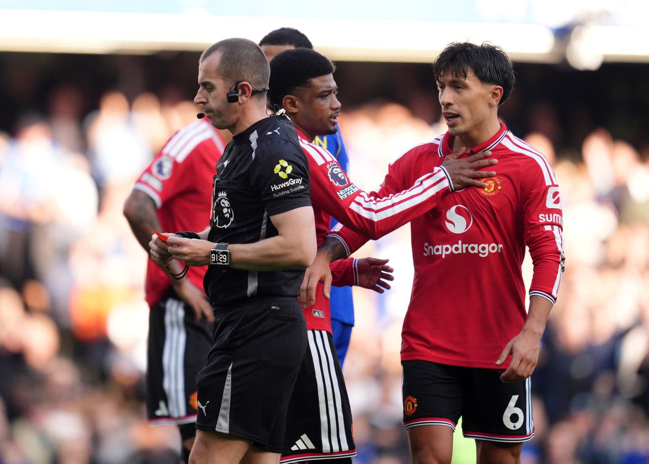 Referee Peter Bankes sends off Manchester United defender Lisandro Martinez 