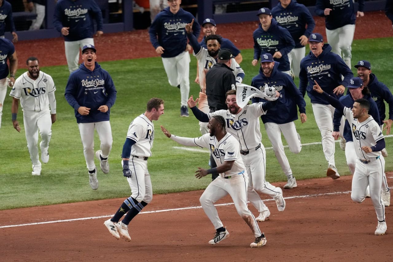 Tampa Bay's Ben Williamson is mobbed by teammates after his game-winning hit.