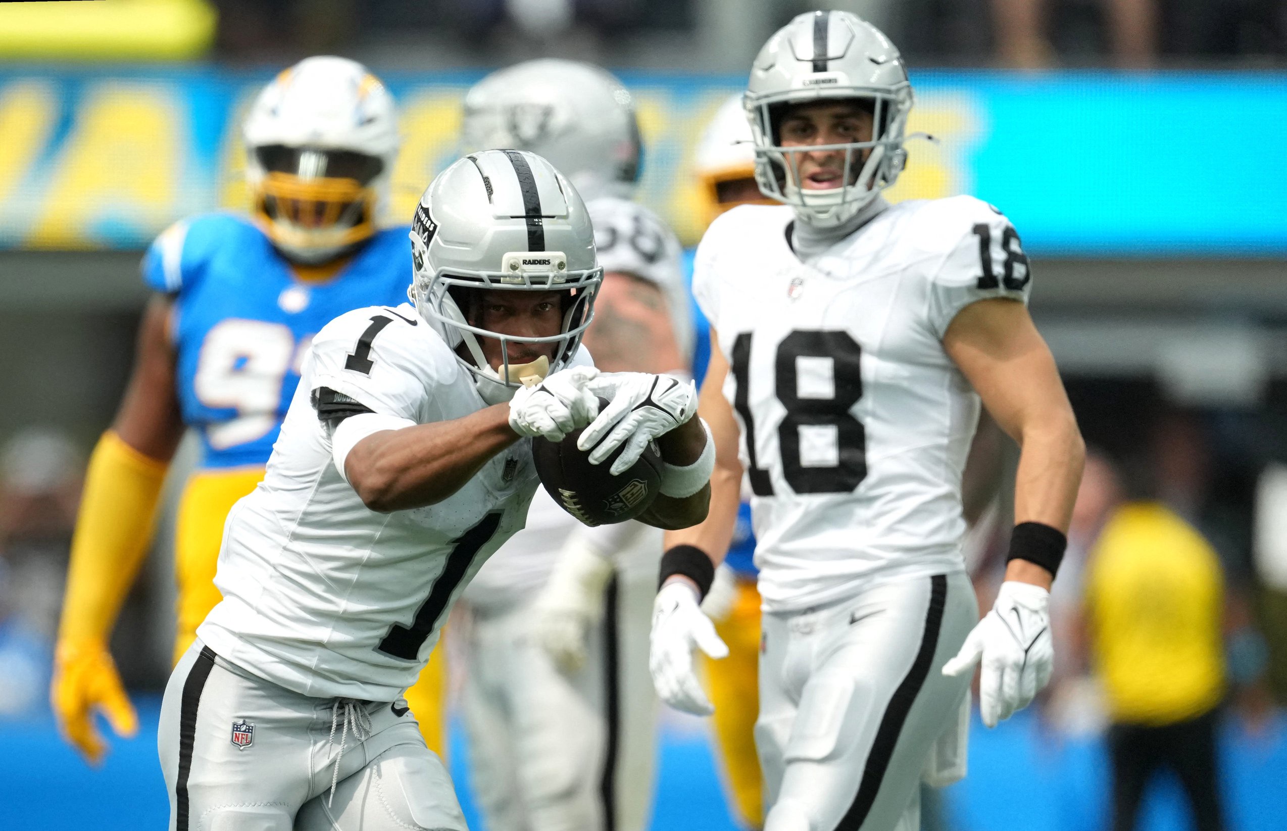 Sep 20, 2026; Inglewood, California, USA;  Las Vegas Raiders wide receiver Tre Tucker (1) celebrates after a first down against the Los Angeles Chargers during the first half at SoFi Stadium.  Mandatory Credit: Kirby Lee-Imagn Images