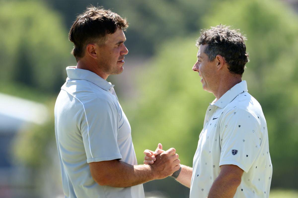 Brooks Koepka and Rory McIlroy shake hands