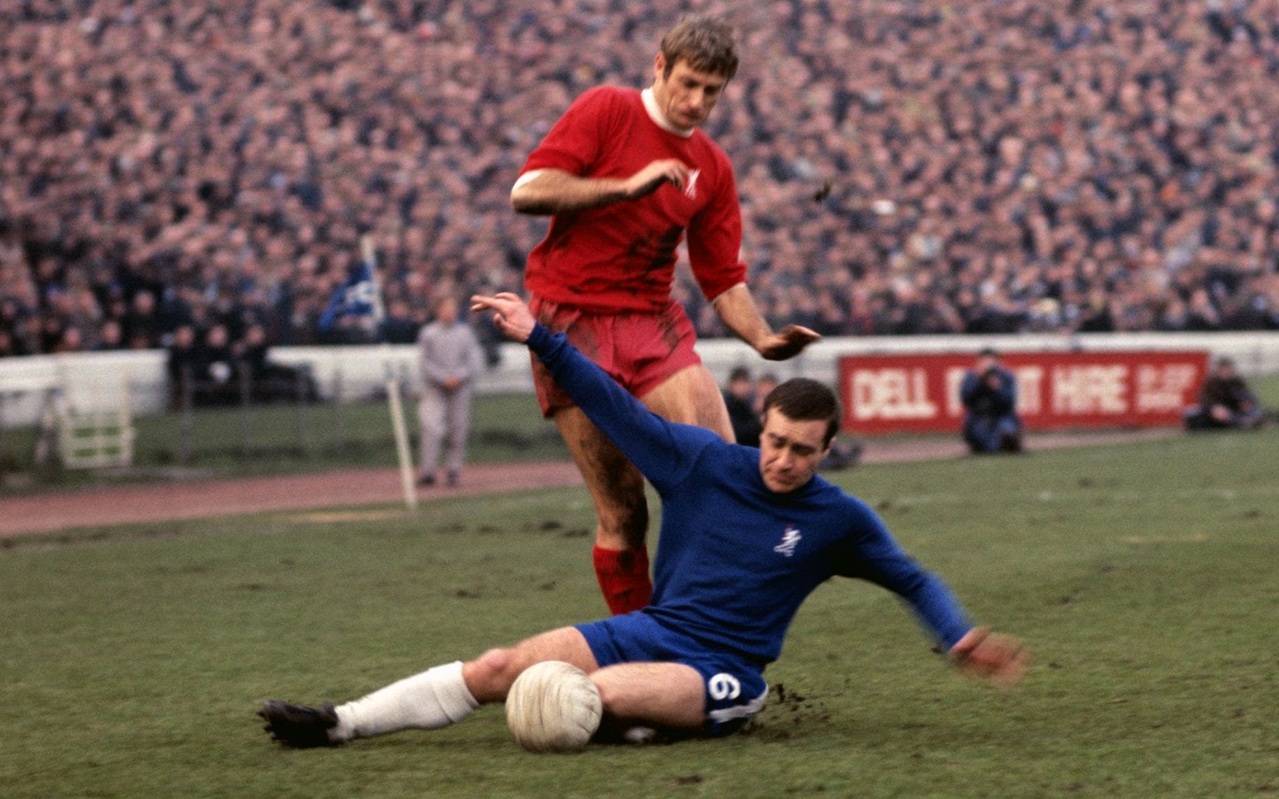 Chelsea's Ron Harris (on floor) tackles Liverpool's Roger Hunt