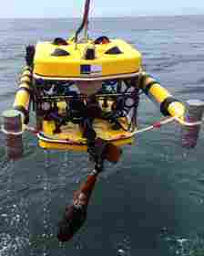 SeaTerra A remotely operated vehicle (ROV) retrieves a grenade from the sea (Credit: SeaTerra)