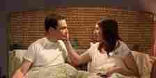 Sheldon and Amy in Bed Talking and Amy Holding Sheldon's Face in The Big Bang Theory