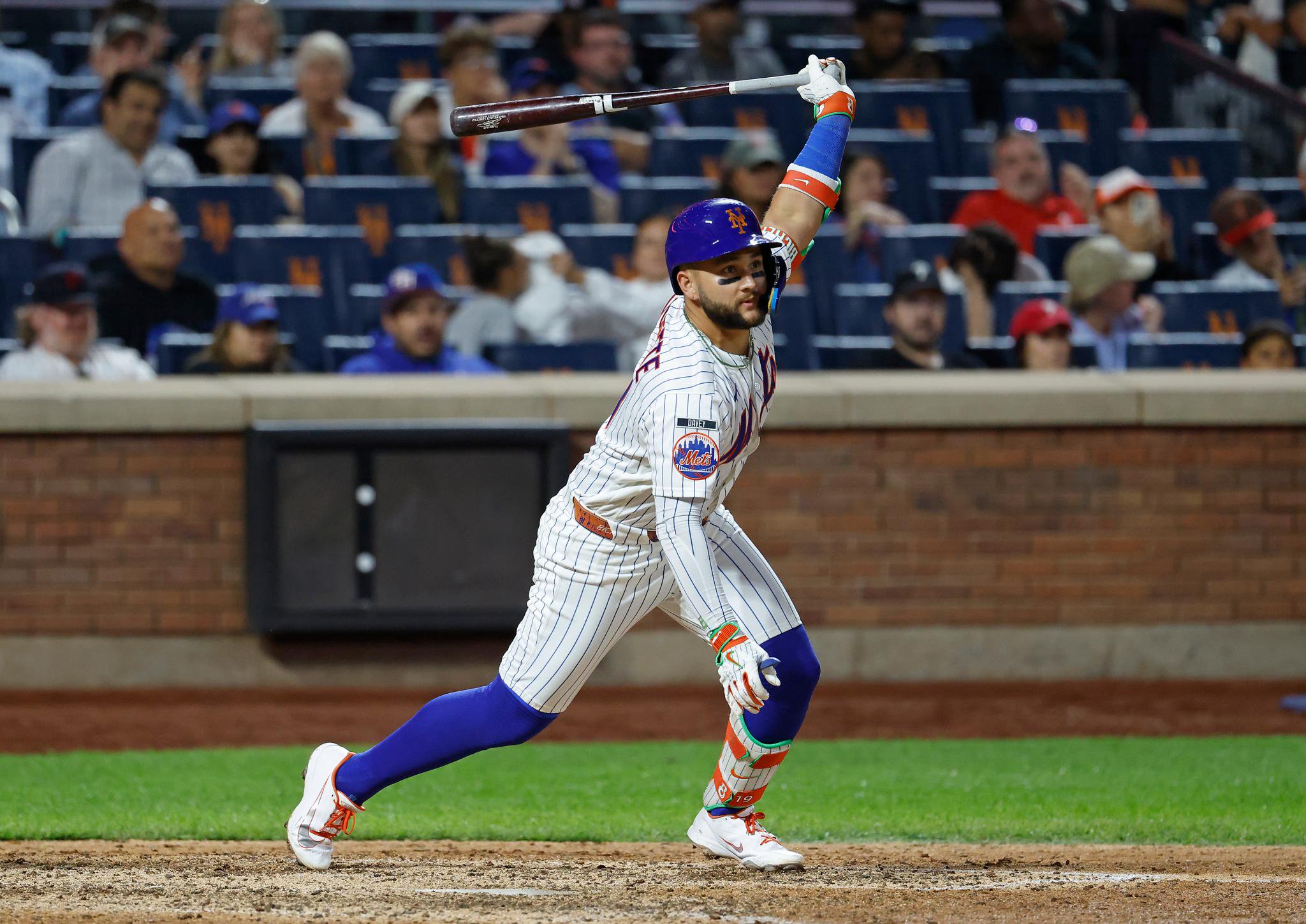 New York Mets third baseman Bo Bichette hits an RBI single in the eighth inning against Citi Field.