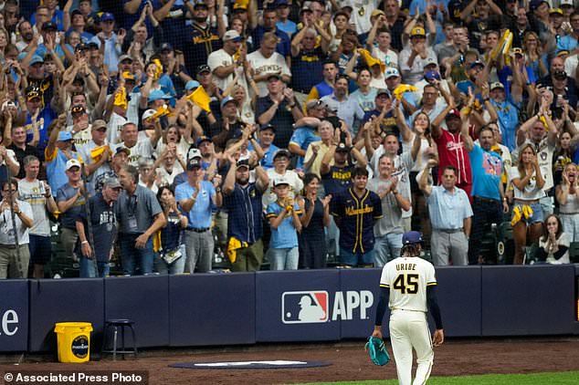 Milwaukee Brewers pitcher Abner Uribe leaves the game during the eighth inning of Game 2 of baseball's National League Championship Series between the Milwaukee Brewers and the Los Angeles Dodgers, Monday, Oct. 12, 2026, in Milwaukee. (AP Photo/Kayla Wolf)