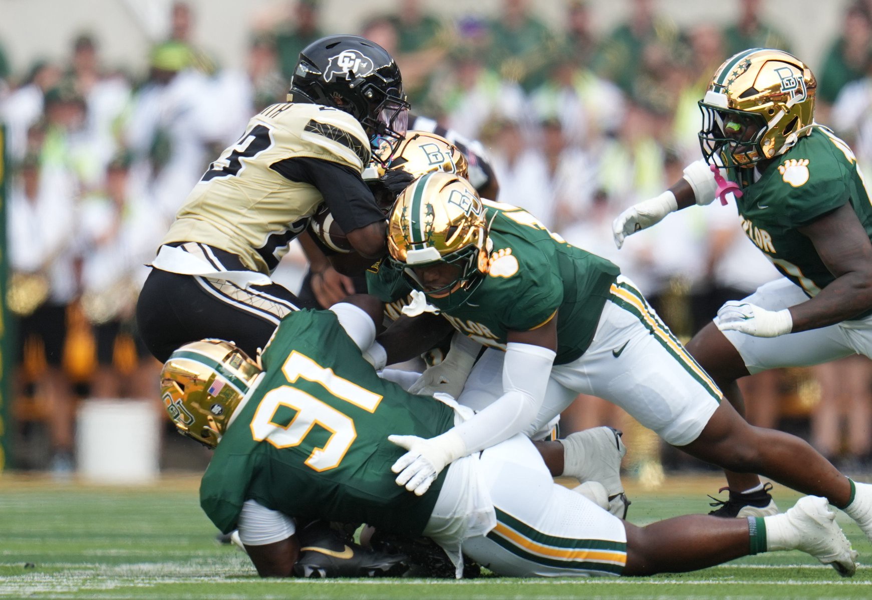Sep 26, 2026; Waco, Texas, USA;  Colorado Buffaloes running back JaQuail Smith (23) is tackled for a loss by Baylor Bears defensive lineman Traevon Mitchell (91) during the first half at McLane Stadium.  Mandatory Credit: Chris Jones-Imagn Images
