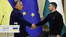 Hungary's Prime Minister Viktor Orban and Ukrainian President Volodymyr Zelenskyy shake hands after 