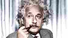 Professor Albert Einstein, now exiled from Germany, calmly smokes his pipe. He is in the United States to give a series of lectures to advanced students at Princeton University.