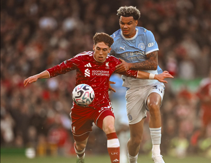 Nico O'Reilly and Victor Munoz in action PHOTO/https://www.facebook.com/LiverpoolFC