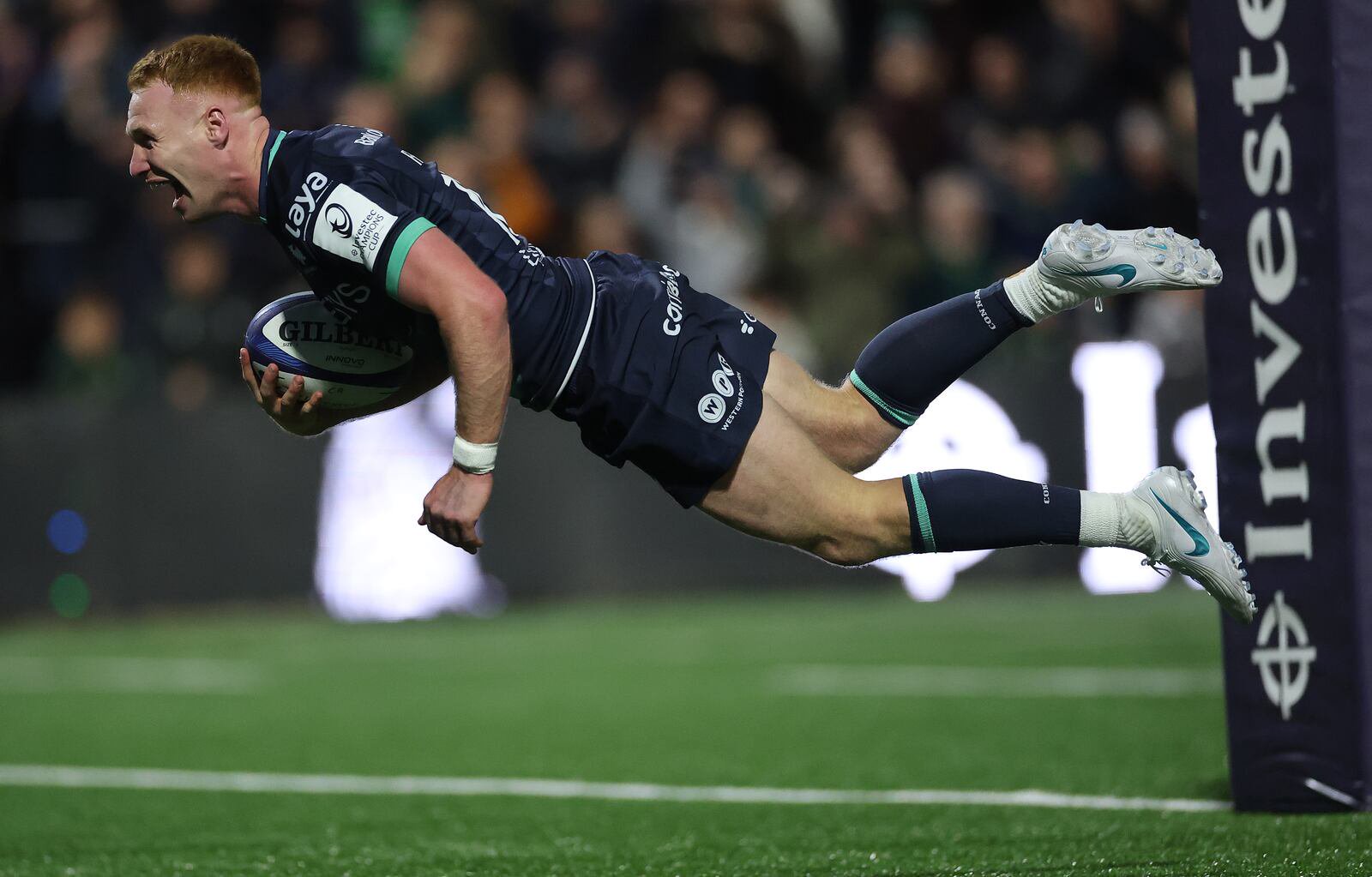 Connacht’s Ciarán Frawley goes airborne to scores his side's second try during the Champions Cup game against Saracens at the Dexcom Stadium. Photograph: James Crombie/Inpho