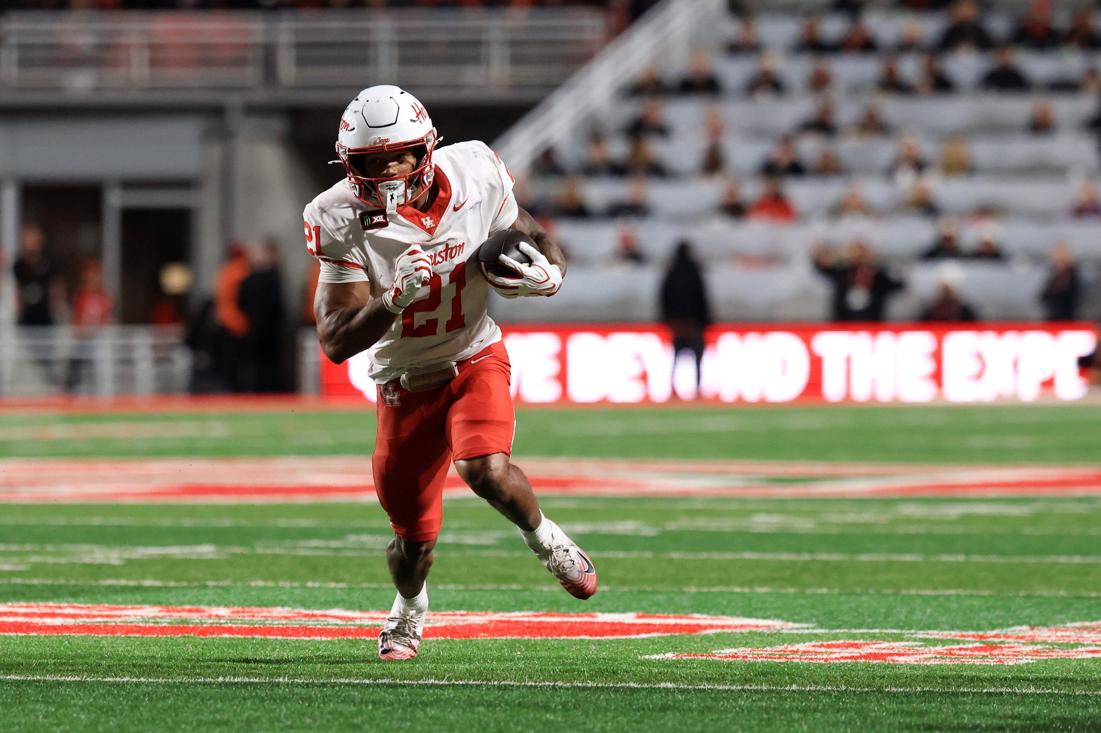 Oct 24, 2026; Salt Lake City, Utah, USA;  Houston Cougars running back Makhi Hughes (21) rushes during the third quarter against the Utah Utes at Rice-Eccles Stadium.  Mandatory Credit: Rob Gray-Imagn Images
