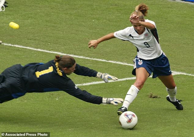 FILE - USA's Mia Hamm (9) tries to shoot past Sweden's goalie Caroline Joensson in the first half of their first round match Sunday, Sept. 21, 2003, at the 2003 Women's World Cup at RFK Stadium in Washington. (AP Photo/Lawrence Jackson, File)