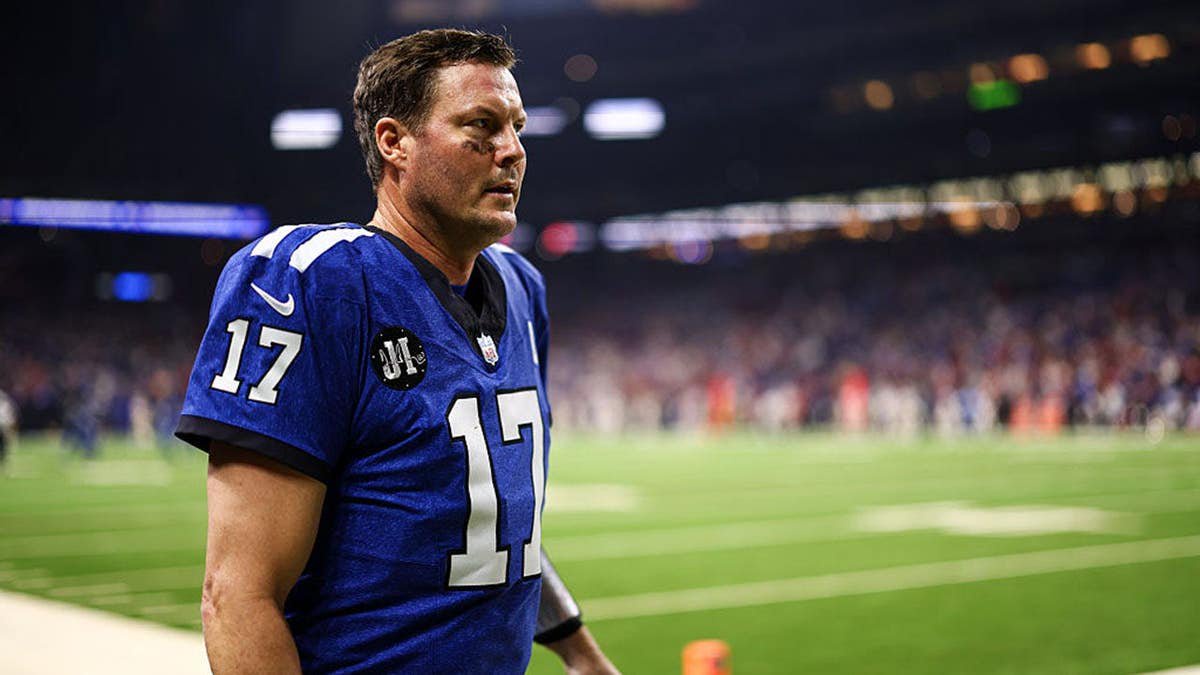 Philip Rivers walks off the field at Lucas Oil Stadium.