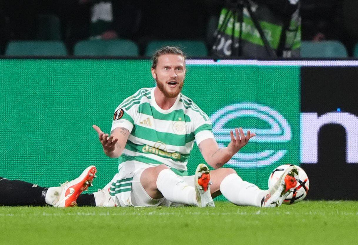 Celtic's Kasper Hogh reacts on the ground after a decision goes against him in the Europa League match against Ferencvaros