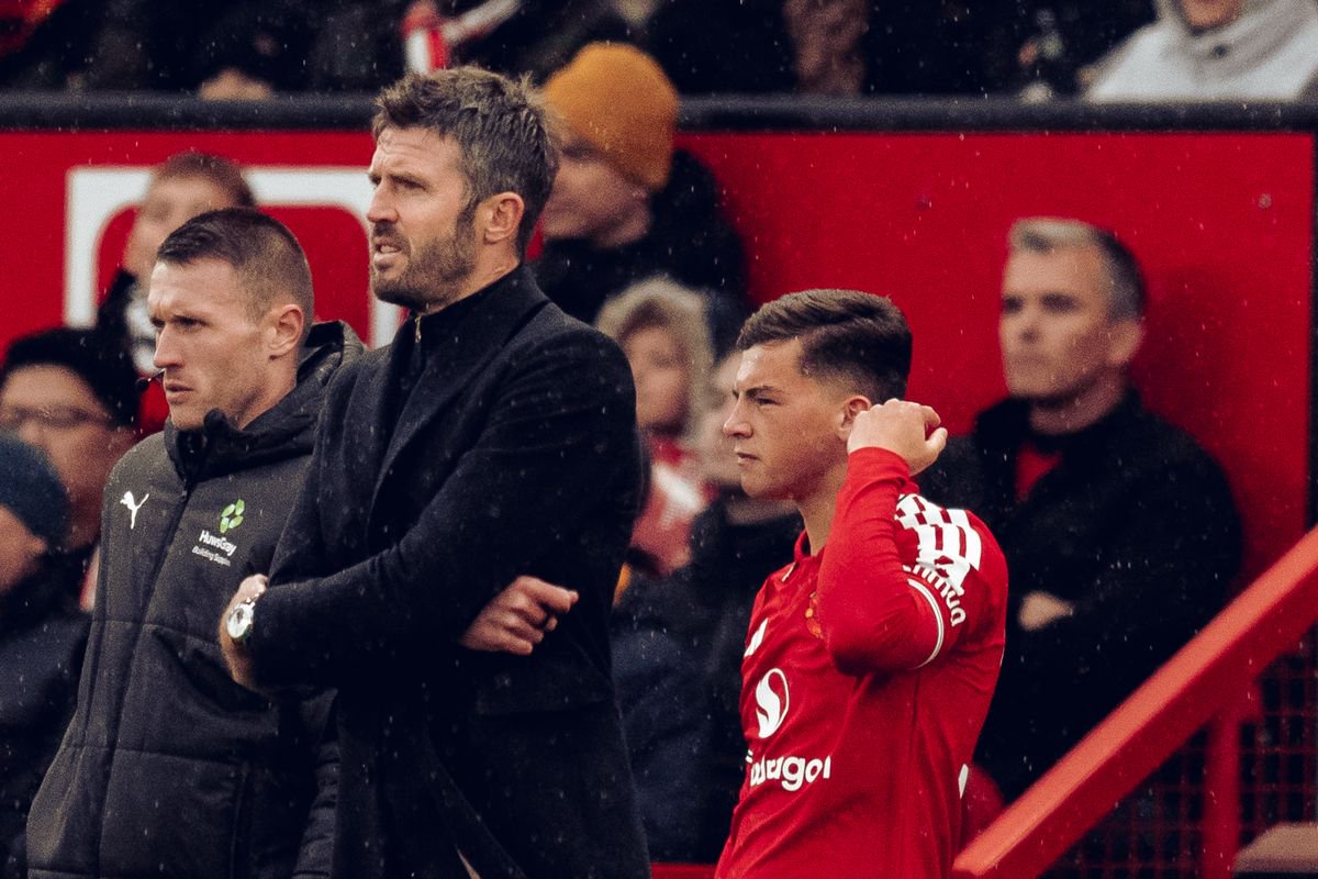 Michael Carrick prepares to introduce Shea Lacey during Manchester United's defeat to Bournemouth