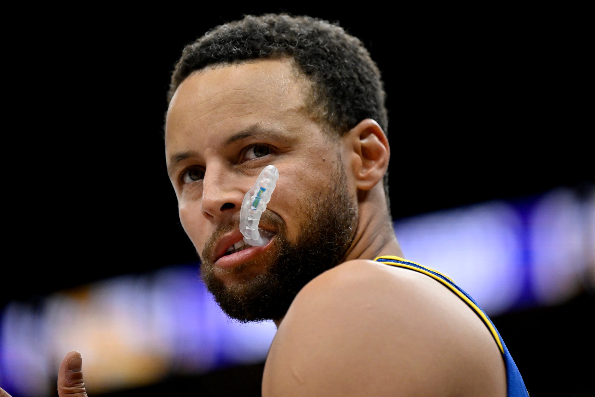 Golden State Warriors guard Stephen Curry warms up before a preseason NBA basketball game against the Los Angeles Lakers.