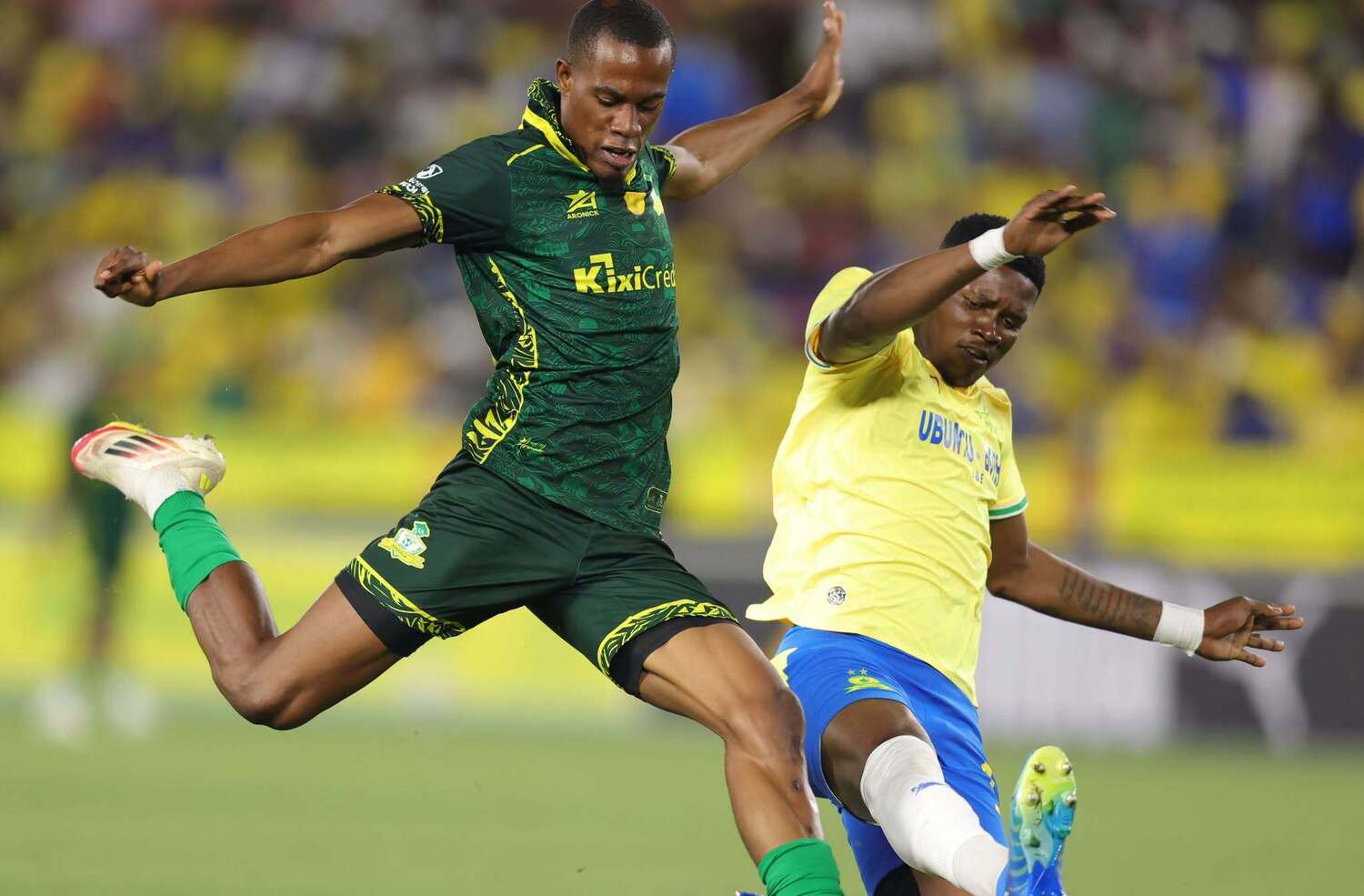 Mamelodi Sundowns midfielder Bathusi Aubaas blocks a Wiliete SC player from taking a shot