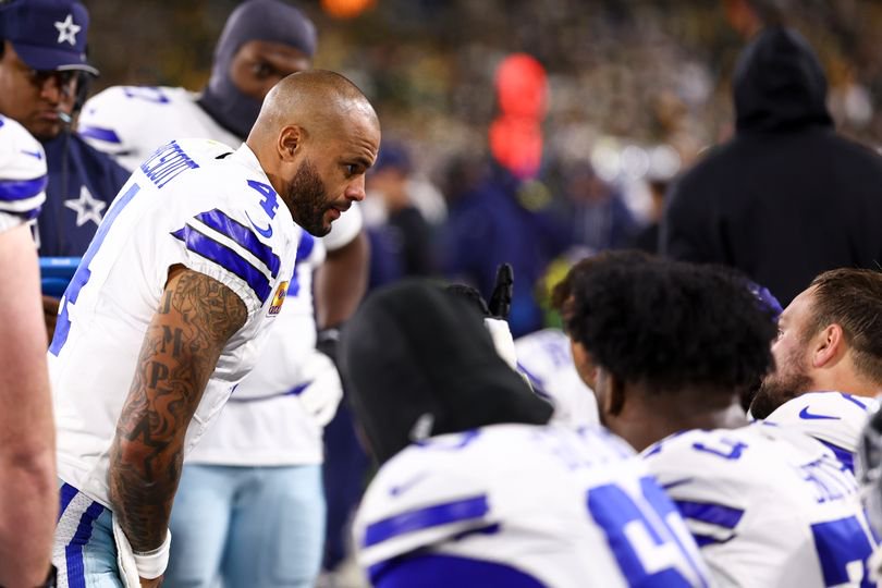 Dallas Cowboys quarterback Dak Prescott and teammates
