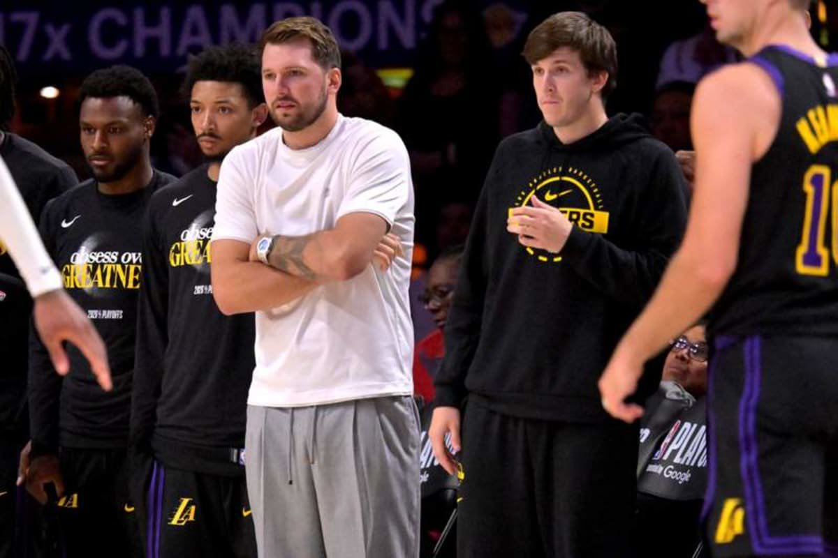 Apr 21, 2026; Los Angeles, California, USA; Los Angeles Lakers guard Luka Doncic (77) and guard Austin Reaves (15) look on from the bench during the second half of game two of the first round of the 2026 NBA Playoffs against the Houston Rockets at Crypto.com Arena. © Jayne Kamin-Oncea-Imagn Images