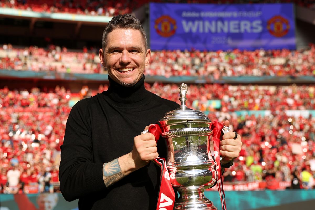 LONDON, ENGLAND - MAY 12:  Manchester United Head Coach / Manager Marc Skinner poses with the trophy at the end of the Adobe Women's FA Cup Final match between Manchester United and Tottenham Hotspur at Wembley Stadium on May 12, 2024 in London, England. (Photo by Charlotte Tattersall - MUFC/Manchester United via Getty Images)