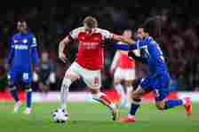 Arsenal midfielder Martin Odegaard battles for possession with Marc Cucurella of Chelsea in the Premier League