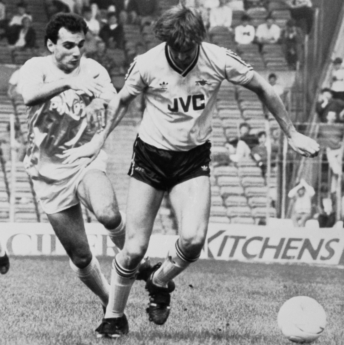 City's Varadi competes for the ball with Arsenal's Tony Adams