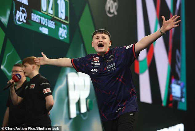 Mitchell Lawrie celebrates winning the Junior Darts Championship title last December