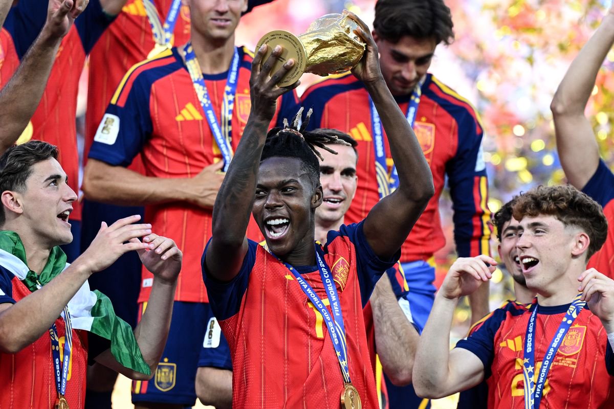 Nico Williams lifting the World Cup trophy