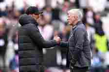 Jurgen Klopp, Manager of Liverpool, interacts with David Moyes, Manager of West Ham United, prior to the Premier League match between West Ham Unit...