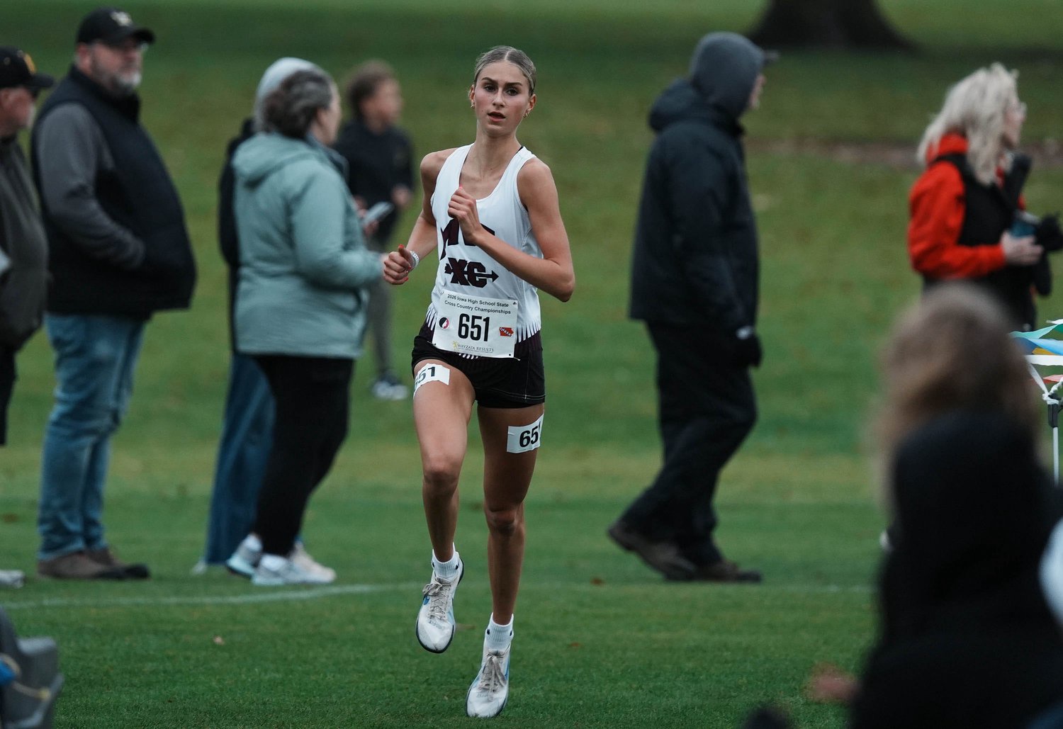 Mount Vernon-Lisbon’s Evelyn Moeller takes the lead during the Class 3A girls state cross country race at Lakeside Municipal Golf Course on Oct. 31, 2026, in Fort Dodge, Iowa.