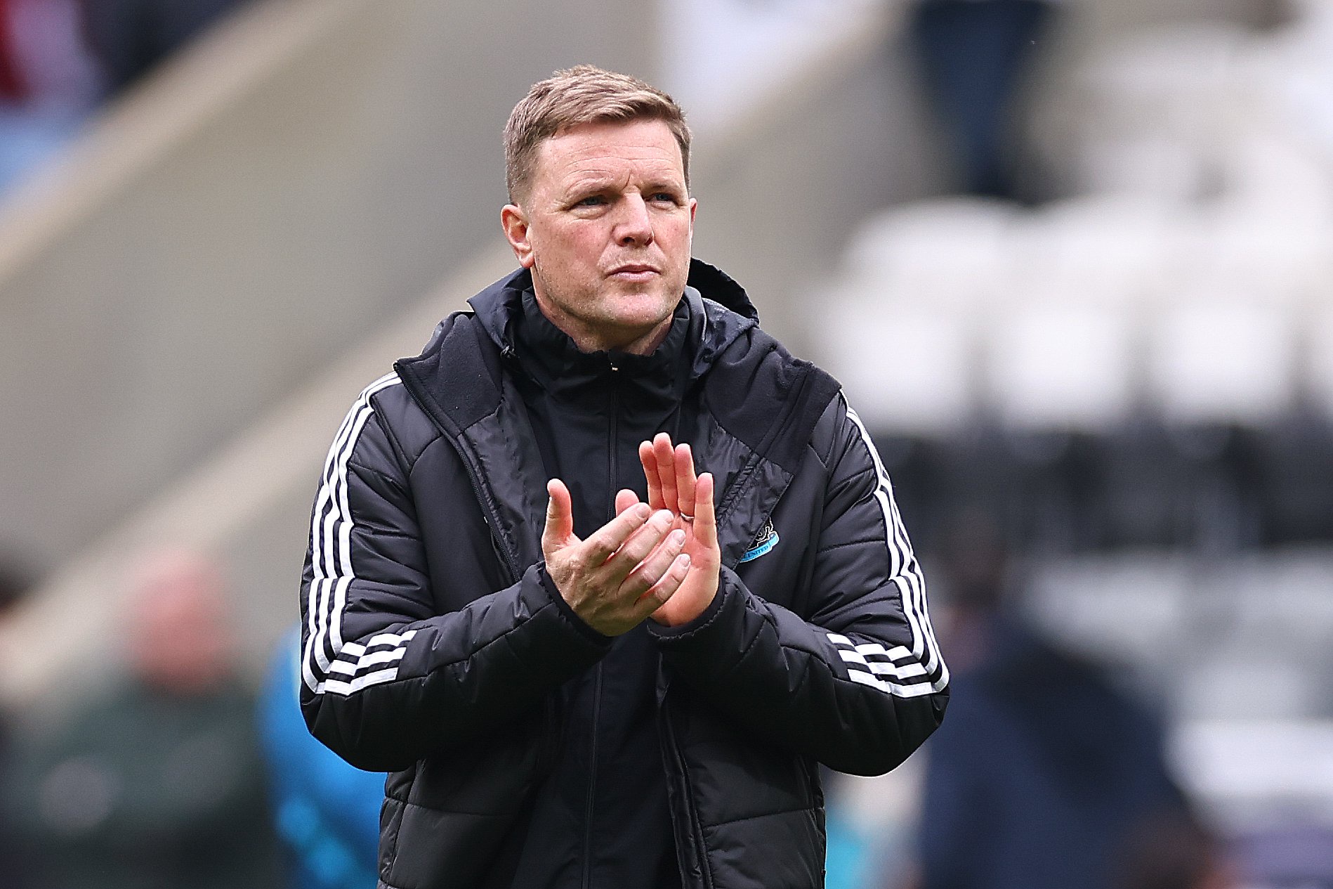 Eddie Howe applauds the fans after Newcastle United's match against Sunderland