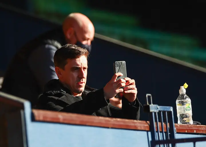  Gary Neville, Salford City Co-owner using his phone prior to the Sky Bet League Two match between Southend United and Salford City at Roots Hall on February 27, 2021 in Southend, England. Sporting stadiums around the UK remain under strict restrictions due to the Coronavirus Pandemic as Government social distancing laws prohibit fans inside venues resulting in games being played behind closed doors. (Photo by Jacques Feeney/Getty Images)