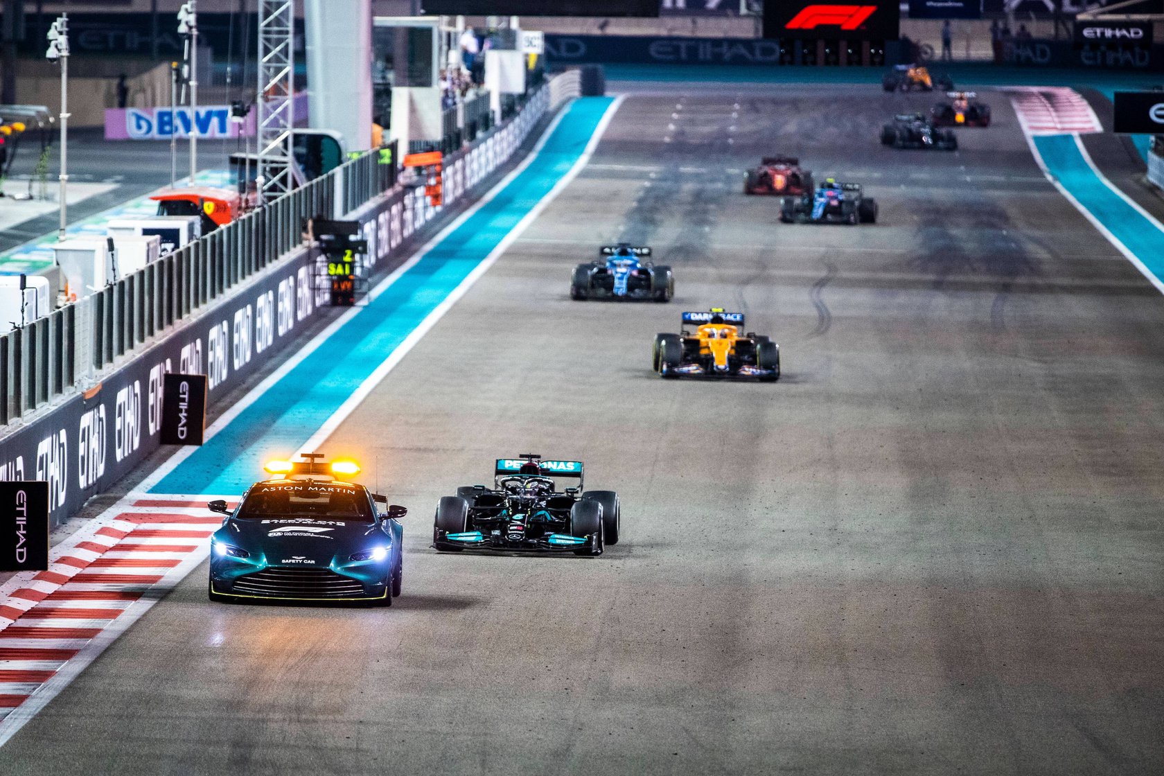 Formula 1 2021: Abu Dhabi GP YAS MARINA CIRCUIT, UNITED ARAB EMIRATES - DECEMBER 12: The Safety Car leads Sir Lewis Ham