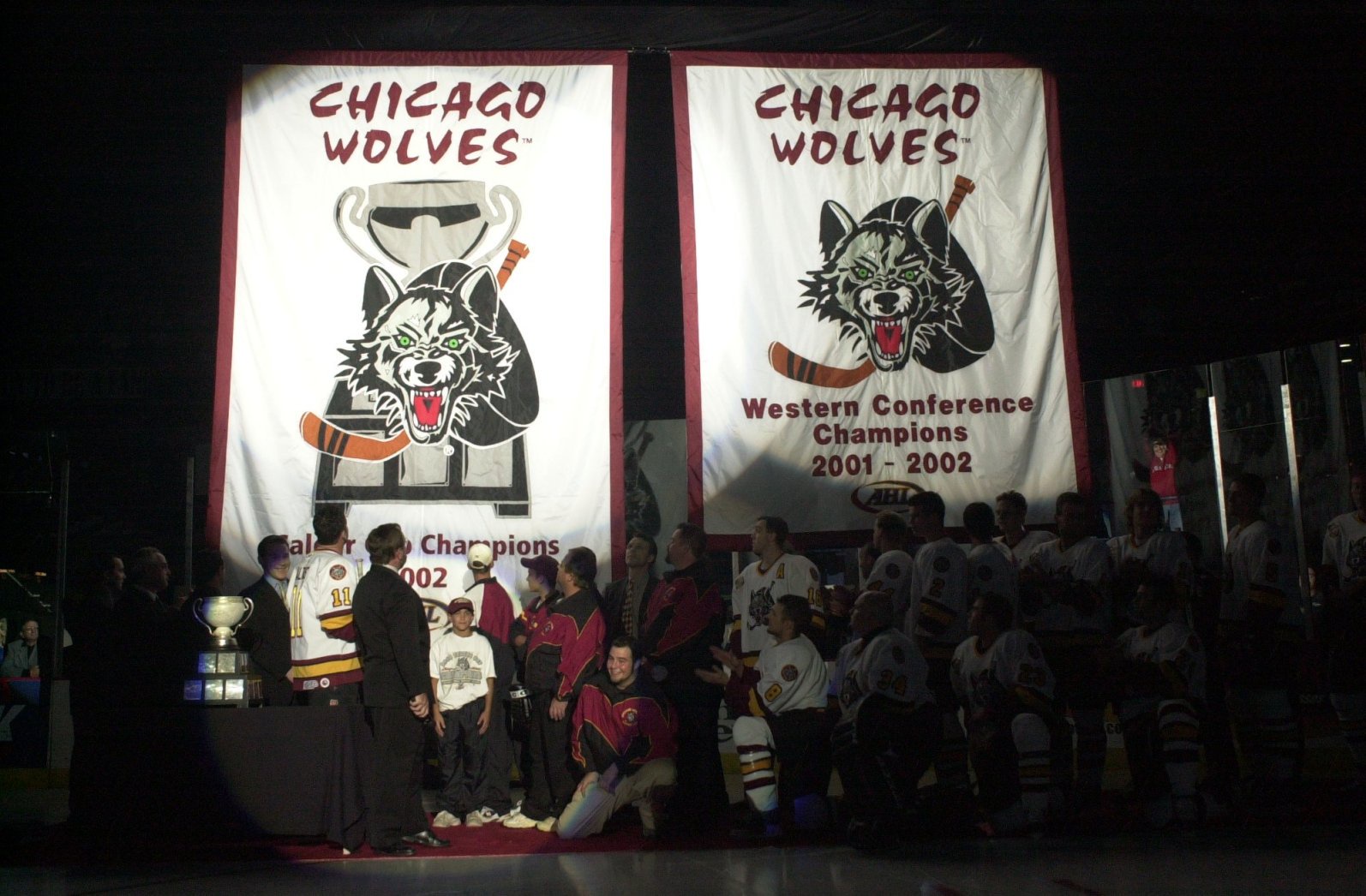 The Chicago Wolves raise their 2002 Calder Cup championship banner during a pregame ceremony on Oct. 12, 2002, at Allstate Arena in Rosemont. (Warren Skalski/For the Chicago Tribune)