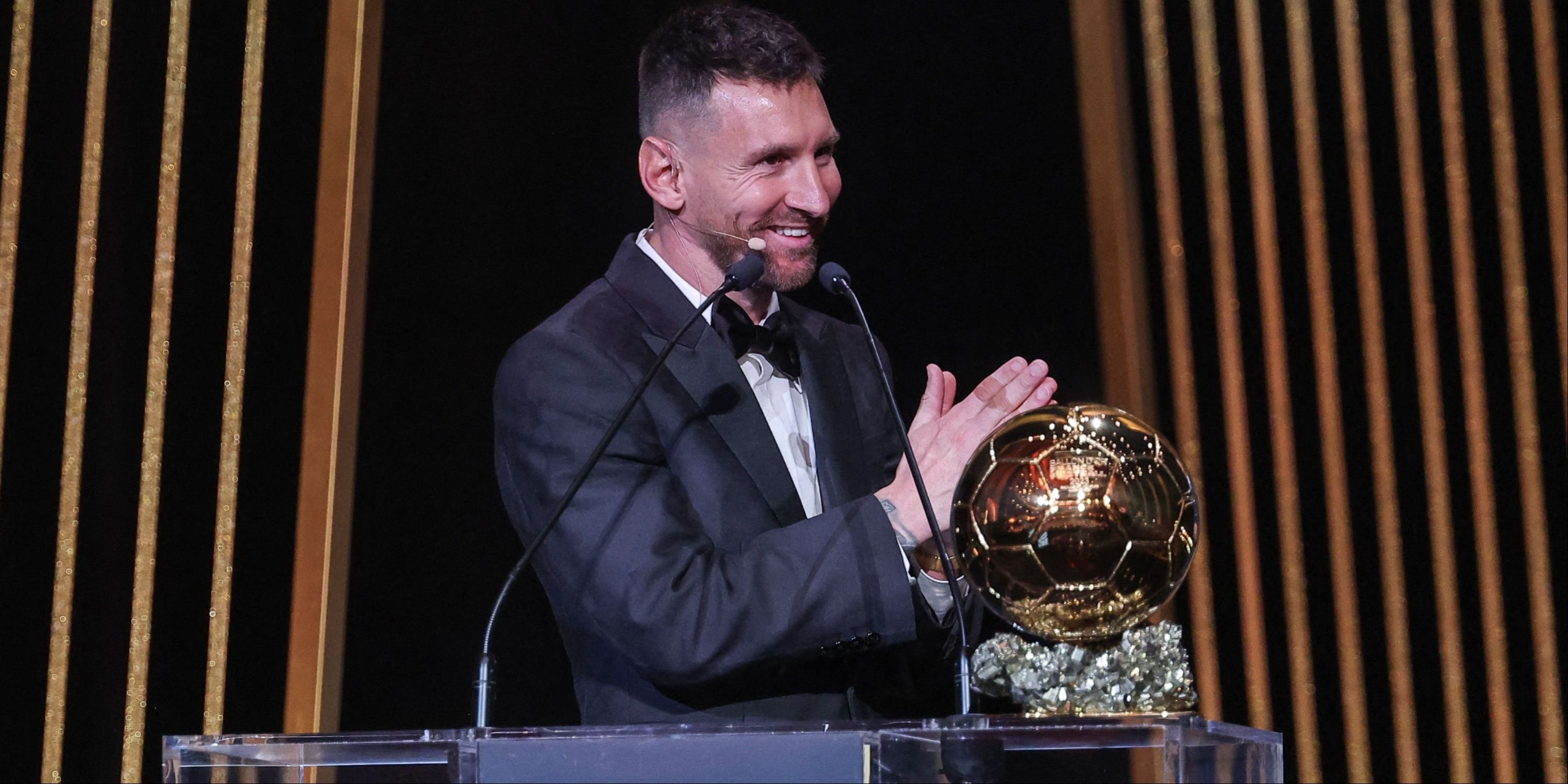 Inter Miami CF's Argentine forward Lionel Messi gestures on stage as he receives his 8th Ballon d'Or award