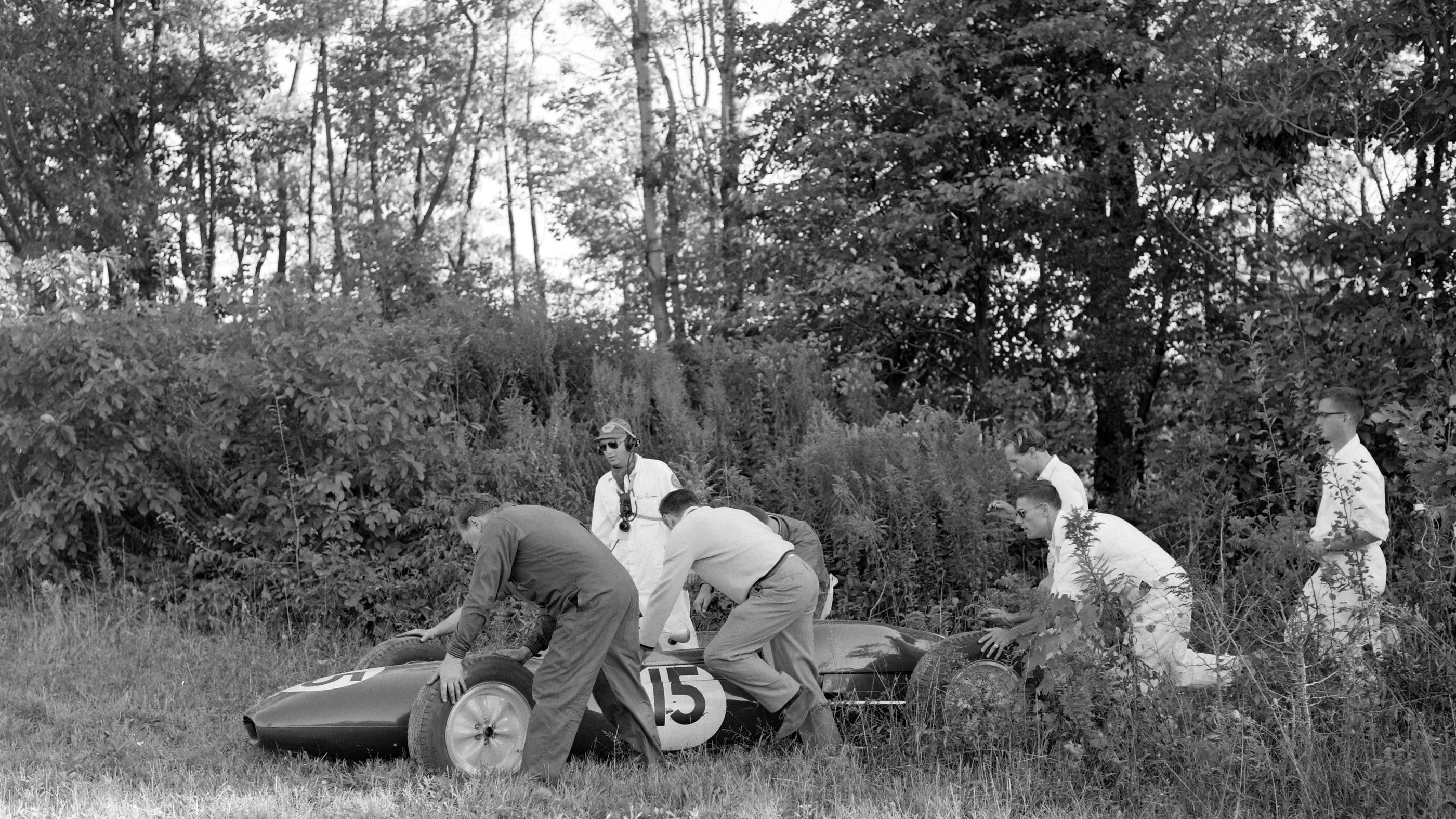 The Lotus of Innes Ireland is retrieved from bushes after going off the circuit at the 1961 US Grand Prix at Watkins Glen