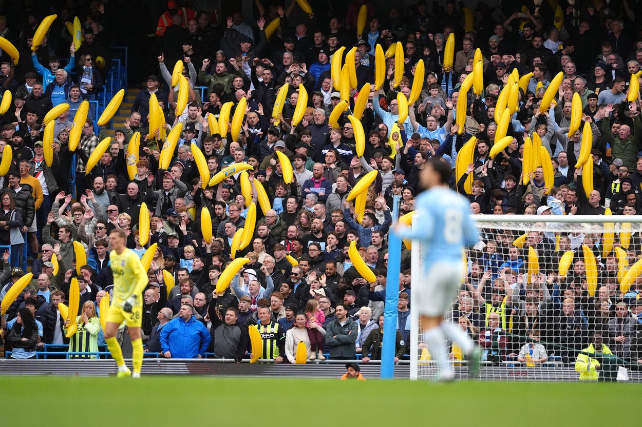 Manchester City fans with inflatable bananas in the stands during the Premier League match at the Etihad Stadium