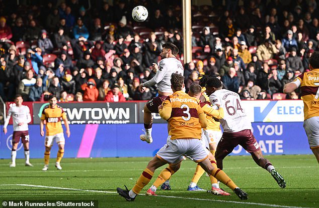 Hearts striker Claudio Braga puts the visiting side ahead with a pinpoint header at Fir Park