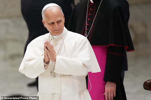 Pope Leo XIV greets participants in an audience with the Jesus Youth International Conference in the Paul VI Hall at the Vatican, Saturday, Oct. 24, 2026. (AP Photo/Alessandra Tarantino)