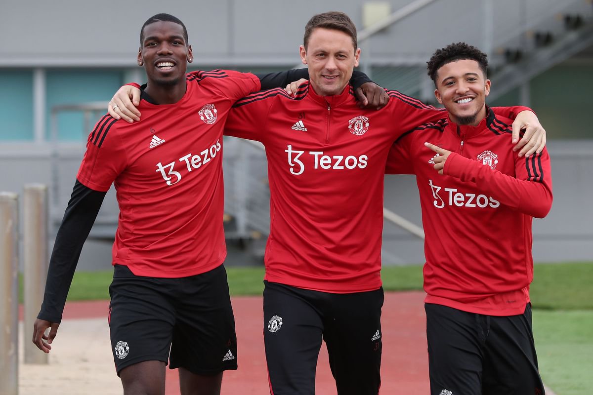 Paul Pogba, Nemanja Matic and Jadon Sancho smiling