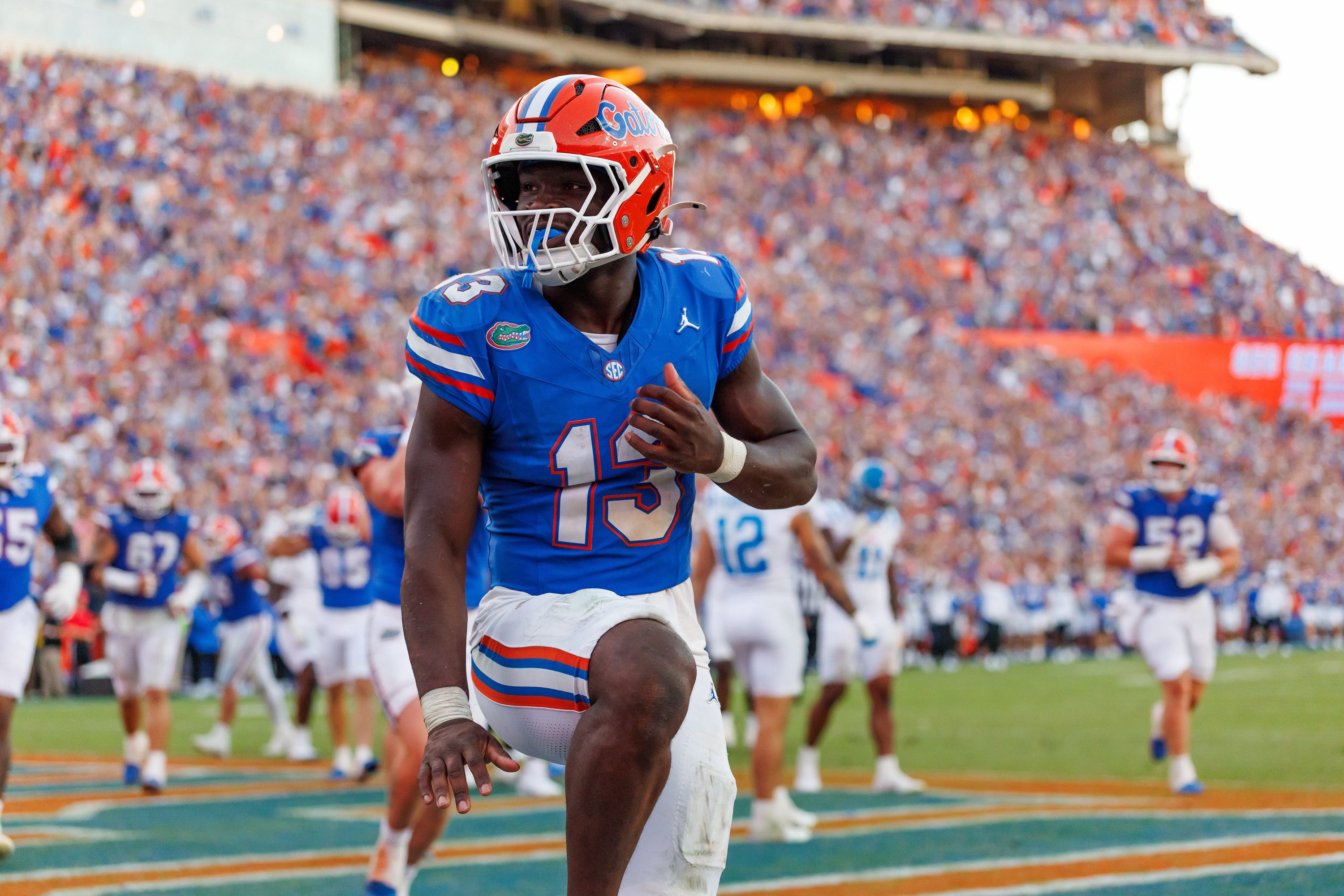 Florida Gators running back Jadan Baugh (13) celebrates with a Heisman pose against the Mississippi Rebels 