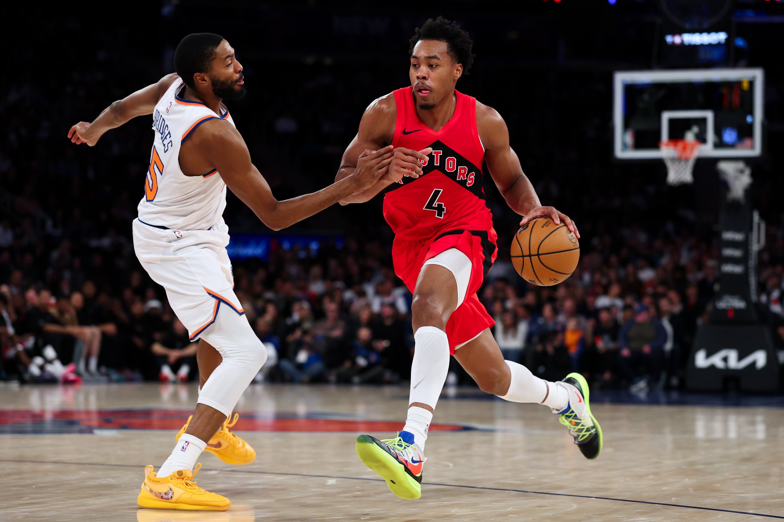 NEW YORK, NEW YORK - OCTOBER 15: Scottie Barnes #4 of the Toronto Raptors drives against Mikal Bridges #25 of the New York Knicks during the first quarter of a preseason game at Madison Square Garden on October 15, 2026 in New York City. NOTE TO USER: User expressly acknowledges and agrees that, by downloading and or using this photograph, User is consenting to terms and conditions of the Getty Images License Agreement. (Photo by Caleb Bowlin/Getty Images)