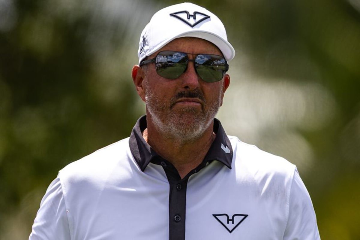Phil Mickelson looks on