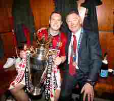 Phil Jones pictured with Sir Alex Ferguson after winning the 2013 Premier League title