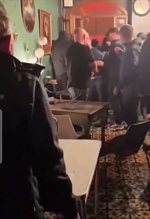 Footage showed the aftermath of the clashes, with tables and chairs moved around the bar and blood seen on the floor