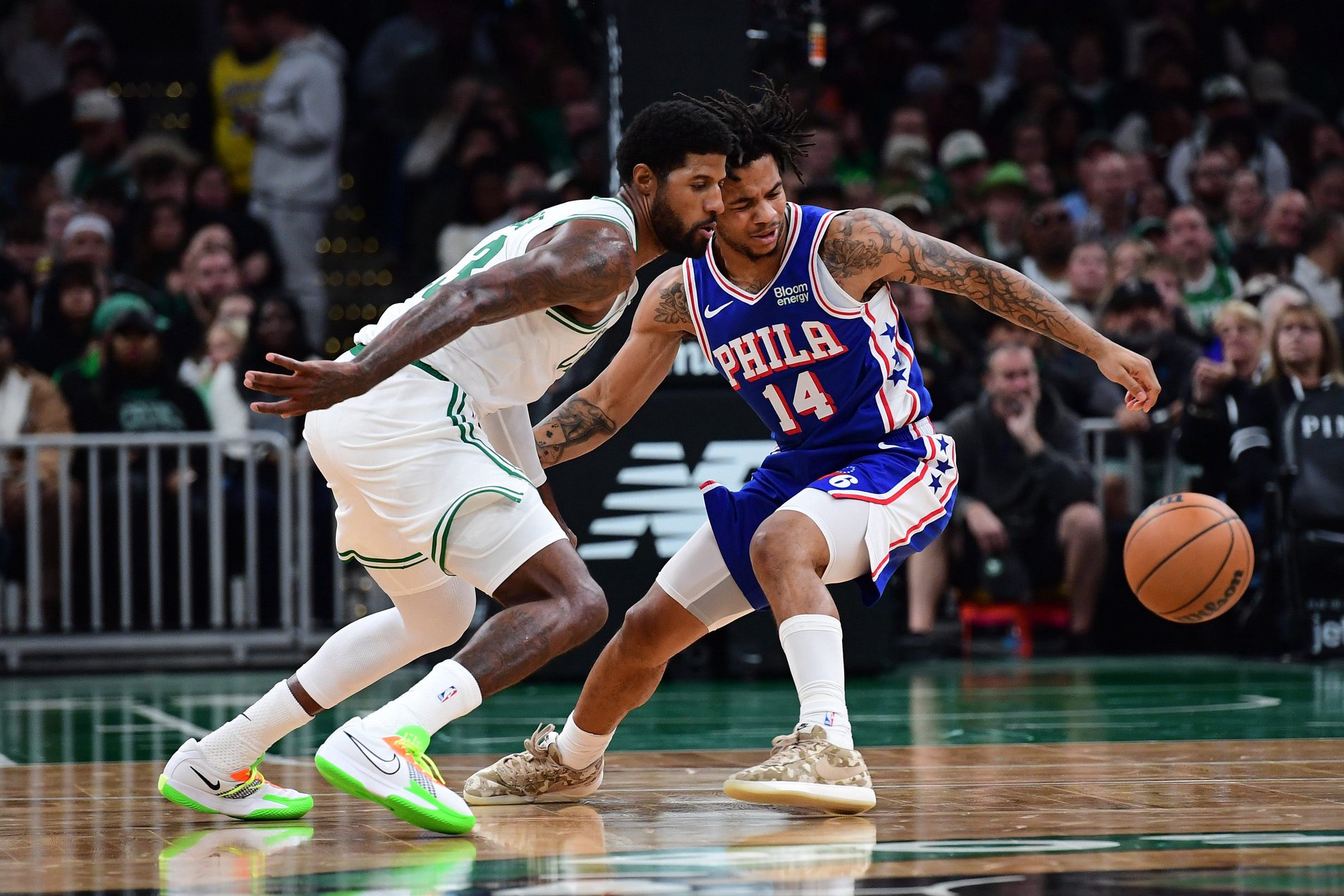 Oct 10, 2026; Boston, Massachusetts, USA;  Boston Celtics forward Paul George (13) steals the ball from Philadelphia 76ers guard Jameer Nelson Jr. (14) during the second half at TD Garden. Mandatory Credit: Bob DeChiara-Imagn Images